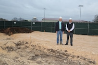 Cy Jary, Con-Cor Incorporated president and Juan Pinon, 902nd Civil Engineering Squadron project manager, pose for a group photo Feb 4, 2013, at the site of a new press box being built at Joint Base San Antonio-Randolph. This press box will be located at the Rambler Fitness Center’s track and field. (U.S. Air Force photo by Joshua Rodriguez/ Released)
