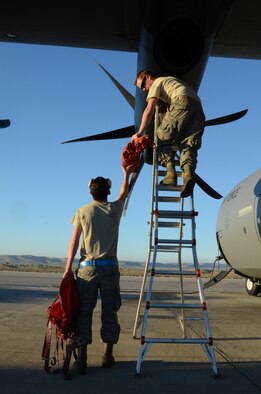 Tech. Sgt. Ramiro Gonzalez helps Staff Sgt. Kenneth Sutton prepare a C-130J Hercules for a training mission at Nevatim Air Force Base, Israel, Feb. 3, 2013. The 86th Airlift Wing conducted a flying training deployment with the Israeli Air Force in order to strengthen partnerships and maintain readiness for contingency operations. Gonzalez is a , 86th Aircraft Maintenance Squadron engine specialist. Sutton is a , 86th AMXS crew chief. (U.S. Air Force photo/2nd Lt. Kay M. Nissen) 