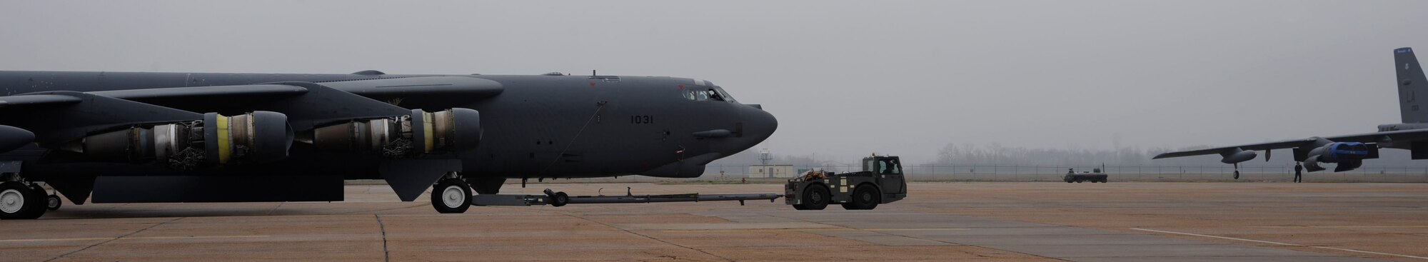 An MB-2 "Yuke" tows a B-52H Stratofortress across the flightline for maintenance and repairs on Barksdale Air Force Base, La., Feb. 5. Proper maintenance and upkeep is essential to keeping the B-52s in fighting shape. For more than 60 years the B-52s have been a mainstay in the Air Force's arsenal by being able to deliver precision munitions to the battlefield from anywhere in the world. (U.S. Air Force photo/Airman 1st Class Andrew Moua)