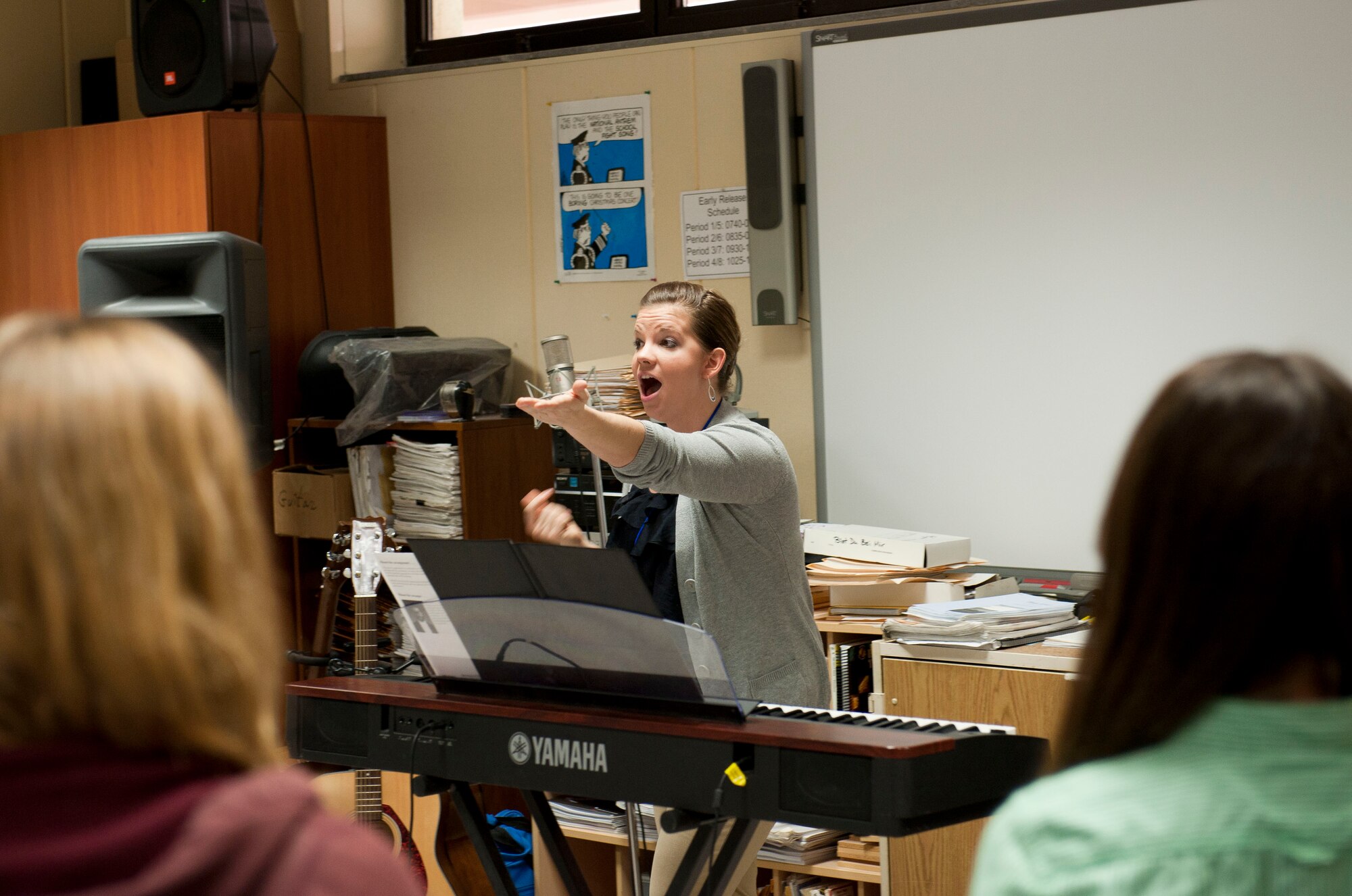 Airman 1st Class Melissa Lackore, U.S. Air Forces in Europe band Touch 'N Go vocalist, leads the Incirlik Unit School choir in song Feb. 7, 2013, at Incirlik Air Base, Turkey. Touch 'N Go will perform at an annual awards ceremony to finish their visit to Incirlik. (U.S. Air Force photo by Senior Airman Clayton Lenhardt/Released)
