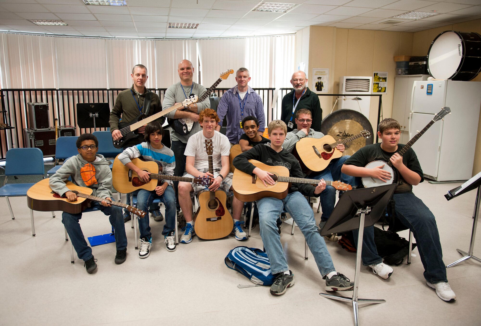 Members of the U.S. Air Forces in Europe band Touch 'N Go pose with Incirlik Unit School guitar players Feb. 7, 2013, at Incirlik Air Base, Turkey. Touch 'N Go performed and gave music lessons at IUS. (U.S. Air Force photo by Senior Airman Clayton Lenhardt/Released)