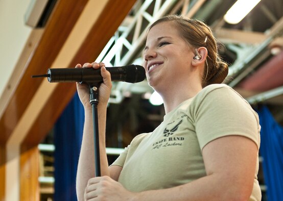 Airman 1st Class Melissa Lackore, U.S. Air Forces in Europe Touch ‘N Go vocalist, sings during a concert at Incirlik Unit School Feb. 4, 2013, at Incirlik Air Base, Turkey. Touch ‘N Go is the pop music ensemble of the USAFE band. (U.S. Air Force photo by Senior Airman Daniel Phelps/Released)
