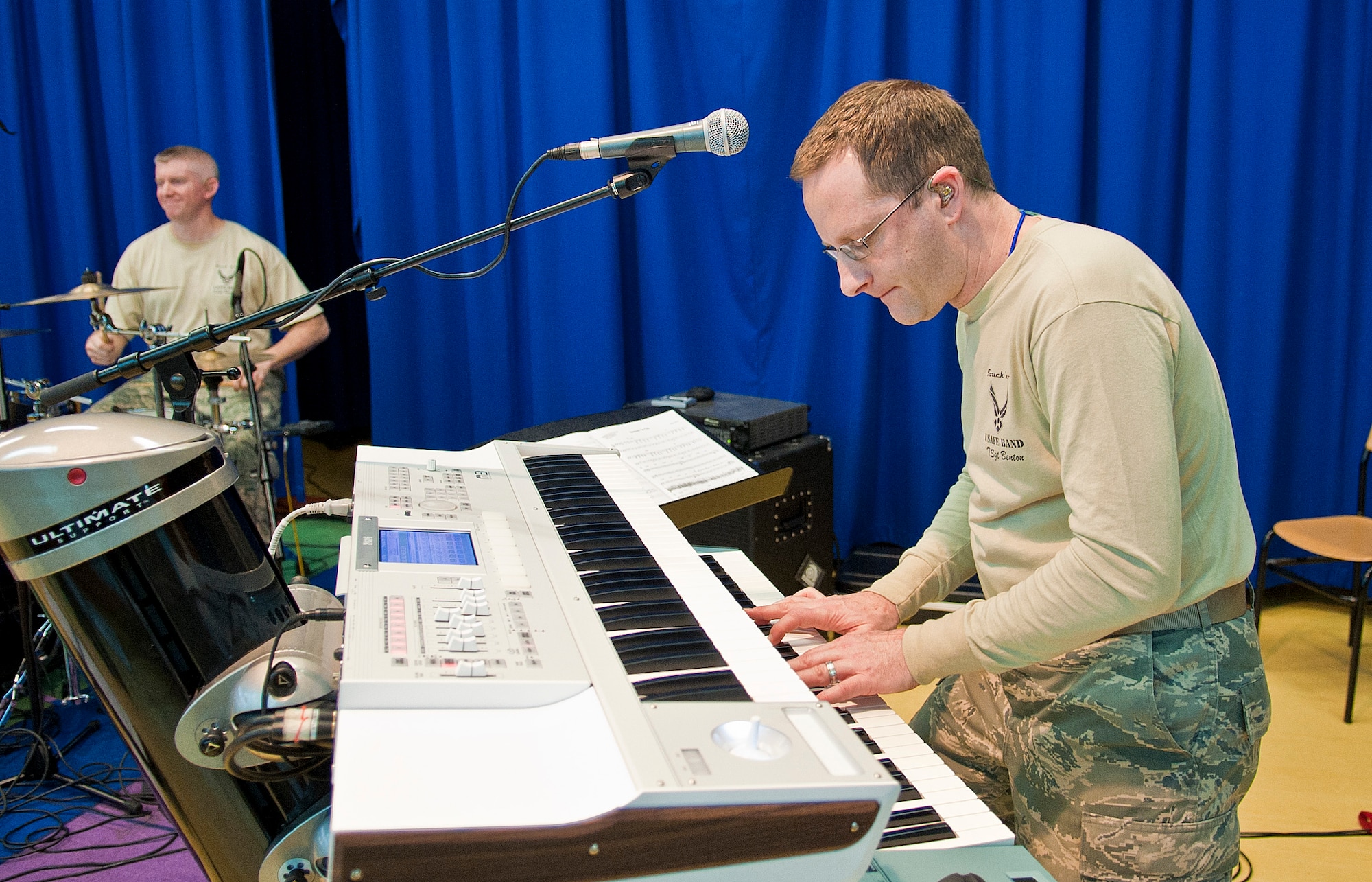 Tech. Sgt. Andrew Benton, U.S. Air Forces in Europe Touch ‘N Go keyboardist, plays the keyboard during a concert at Incirlik Unit School Feb. 4, 2013, at Incirlik Air Base, Turkey. Touch ‘N Go is the pop music ensemble of the USAFE band. Their song list covers the spectrum of popular music from R&B to country. (U.S. Air Force photo by Senior Airman Daniel Phelps/Released)