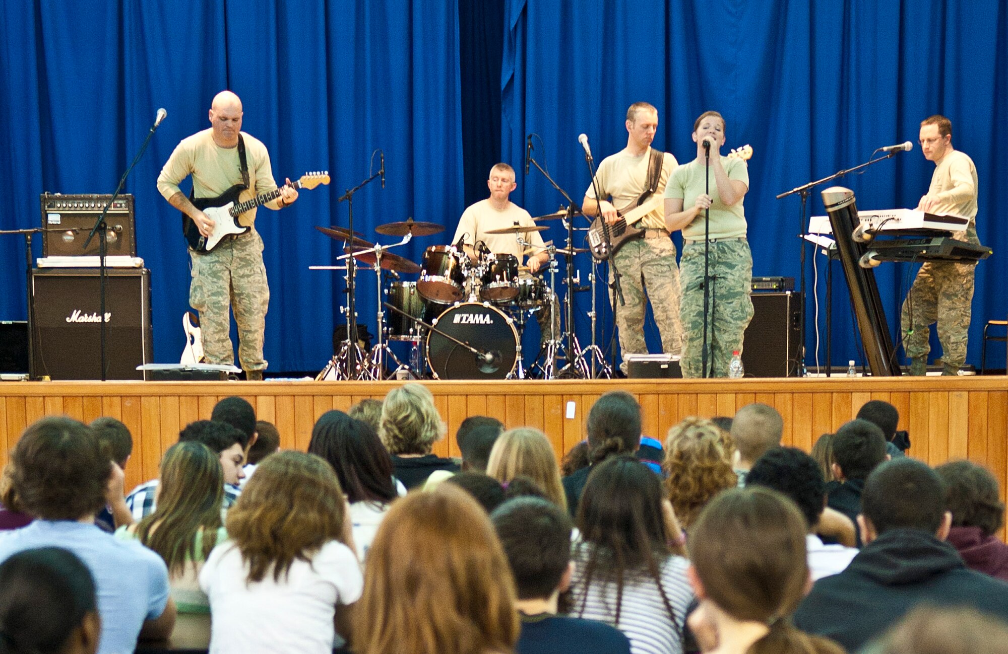 Incirlik Unit School students listen as Touch ‘N Go, the U.S. Air Forces in Europe pop music band, during a concert at IUS Feb. 4, 2013, at Incirlik Air Base, Turkey. Since 1976, Touch ‘N Go has performed for millions, touring throughout Europe, Scandinavia and Southwest Asia providing troop support and public engagement in various venues. (U.S. Air Force photo by Senior Airman Daniel Phelps/Released)