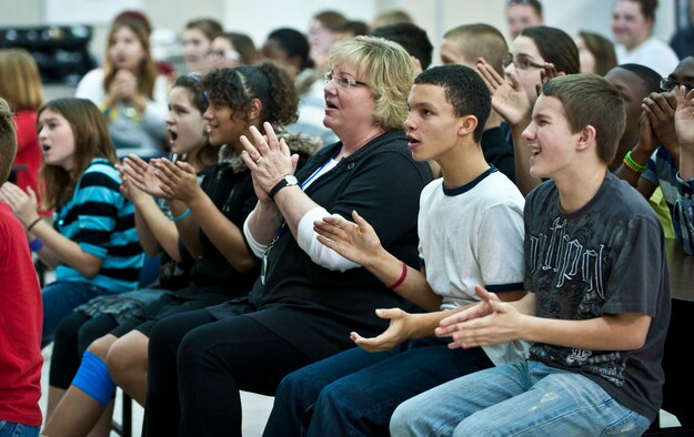 Incirlik Unit School students clap to the music as the U.S. Air Forces in Europe band Touch ‘N Go performs a concert in the IUS cafeteria Feb. 4, 2013, at Incirlik Air Base, Turkey. Touch ‘N Go performers aim to provide a unique and exciting musical experience as they represent the cutting edge and the golden past of American popular music. (U.S. Air Force photo by Senior Airman Daniel Phelps/Released)