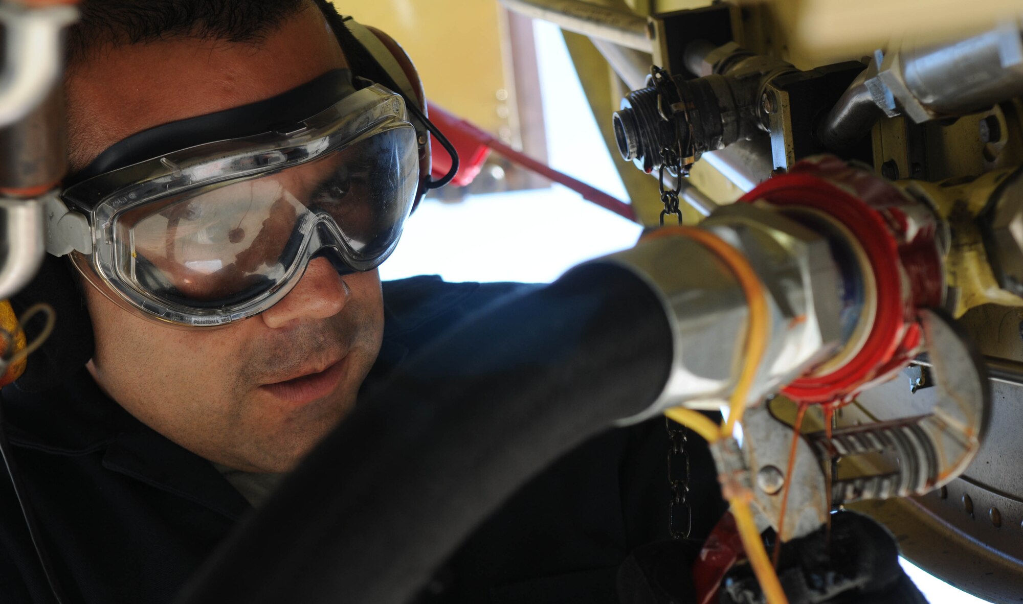 Tech. Sgt. Richard Mora, 100th Aircraft Maintenance Squadron, tightens a hydraulic line on a KC-135 Stratotanker to be lifted on hydraulic jacks Feb. 5, 2013, at an air base in southwest Europe. Jacks allow maintainers to conduct tests involving raising and lowering the aircraft’s landing gear. Airmen RAF Mildenhall, England, deployed to southwest Europe in January to support French operations in Mali. Mora is from San Diego. (U.S. Air Force photo by Staff Sgt. Austin M. May)