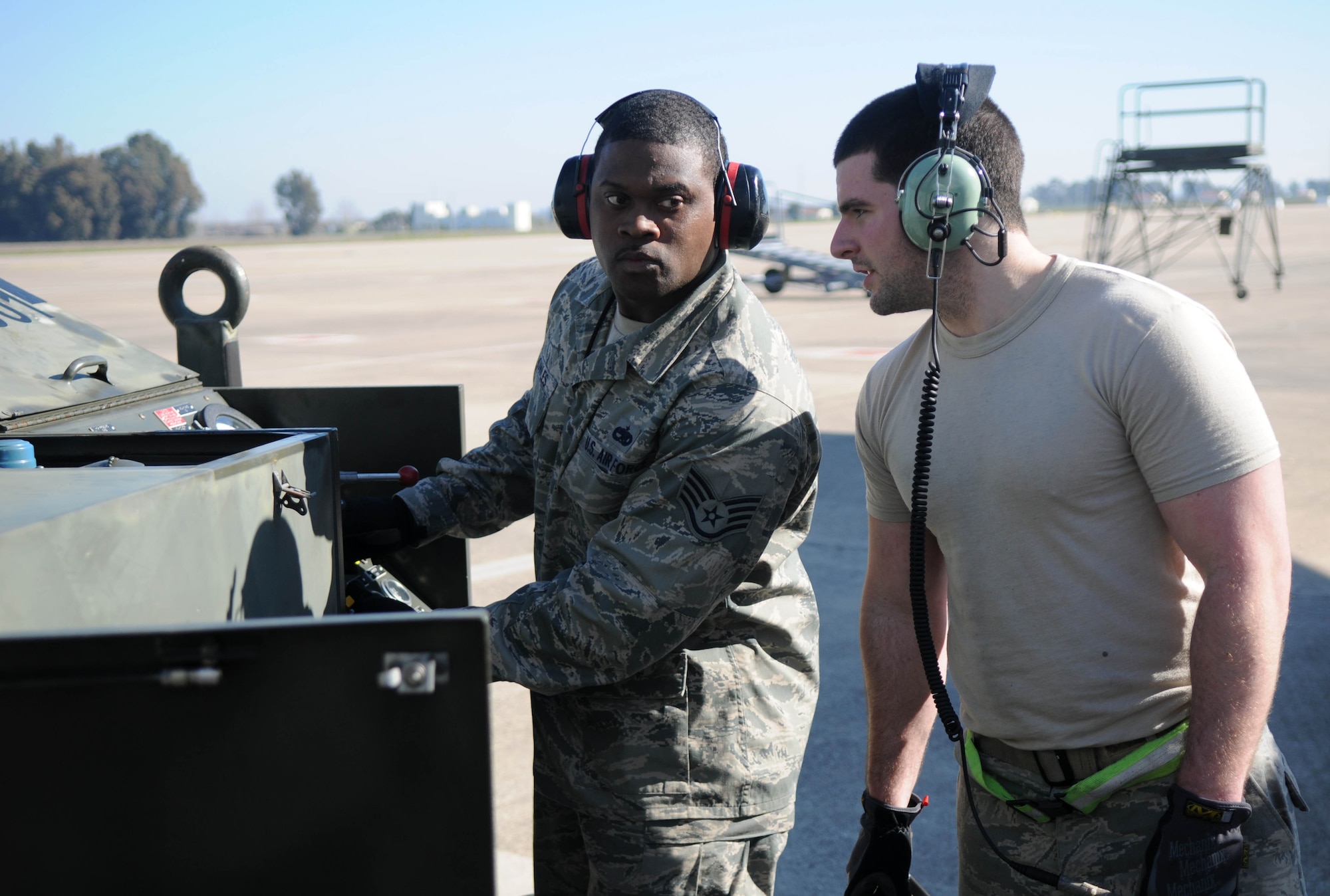 Staff Sergeants Nicholas Carone and Tremain Knowles, 100th Aircraft Maintenance Squadron, discuss the progress of lifting of a KC-135 Stratotanker on hydraulic jacks Feb. 5, 2013, at an air base in southwest Europe. Jacks allow maintainers to conduct tests involving raising and lowering the aircraft’s landing gear. Airmen from RAF Mildenhall, England, deployed to southwest Europe in January to support French operations in Mali. Carone is from Elk Grove, Calif., and Knowles is from Ft. Lauderdale, Fla. (U.S. Air Force photo by Staff Sgt. Austin M. May)