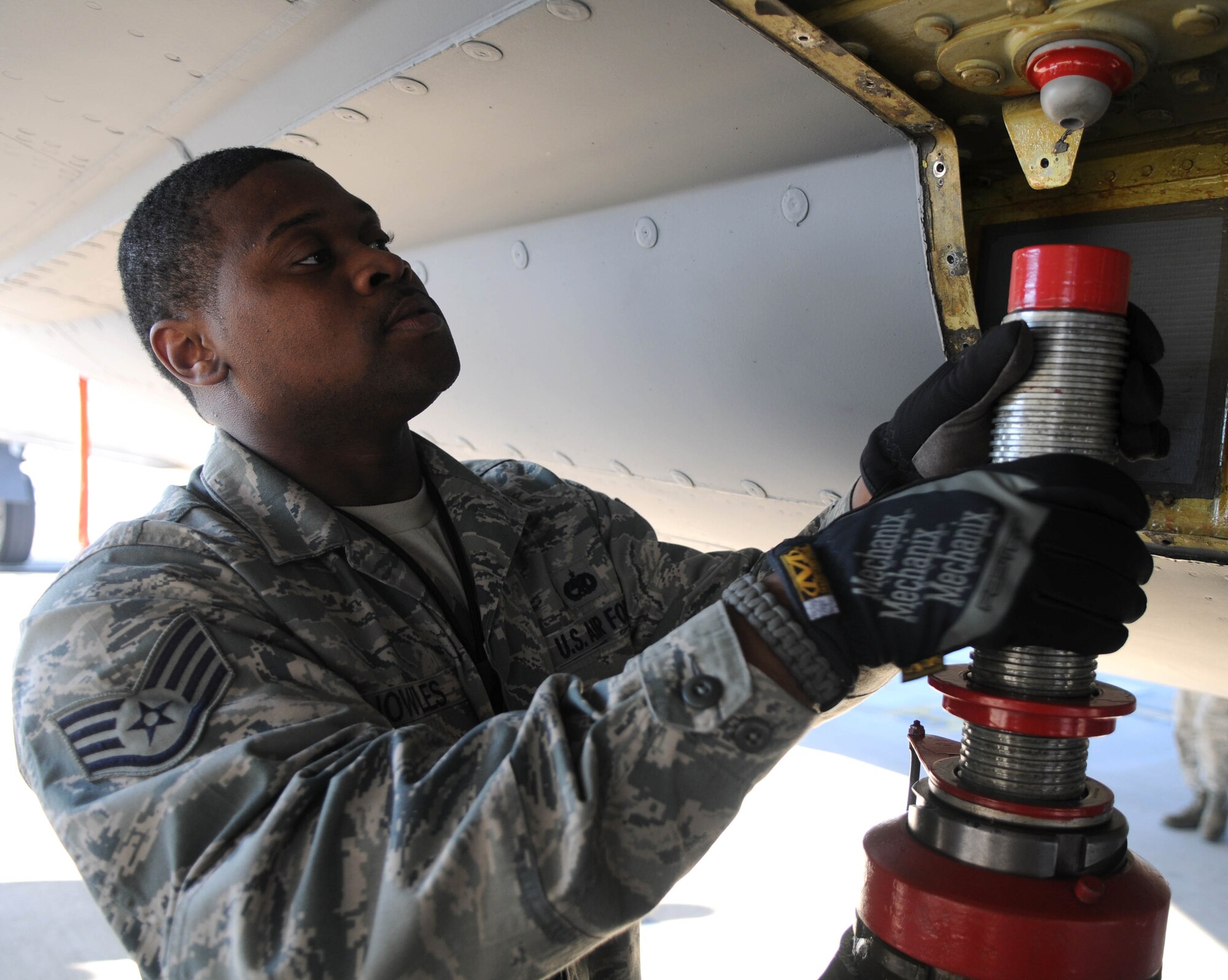 Staff Sgt. Tremain Knowles, 100th Aircraft Maintenance Squadron, adjusts a hydraulic tripod jack under a KC-135 Stratotanker Feb. 5, 2013, at an air base in southwest Europe. Jacks allow maintainers to conduct tests involving raising and lowering the aircraft’s landing gear. Airmen from RAF Mildenhall, England, deployed to southwest Europe in January to support French operations in Mali. Knowles is from Ft. Lauderdale, Fla. (U.S. Air Force photo by Staff Sgt. Austin M. May)
