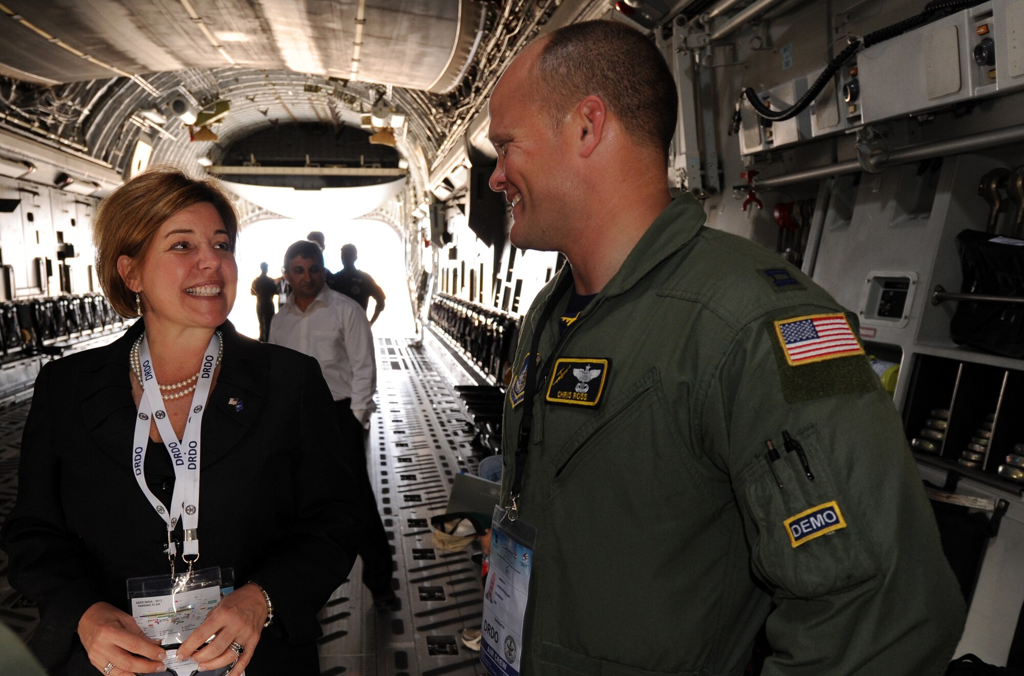Heidi H. Grant, Deputy Under Secretary of the Air Force, International Affairs, laughs with Capt. Chris Ross, a Pacific Air Forces C-17 Globemaster III demonstration team pilot, during a tour of the demonstration aircraft during the Aero India 2013 air show at Air Force Station Yelahanka, Bangalore, India, Feb 7. The air show allowed members of the U.S. military to interact with numerous members of international militaries and discuss the capabilities of their aircraft. The U.S. military was represented by C-17 and F-16 demonstration teams and a KC-135 static display. (U.S. Air Force photo by Capt. Ben Sakrisson)