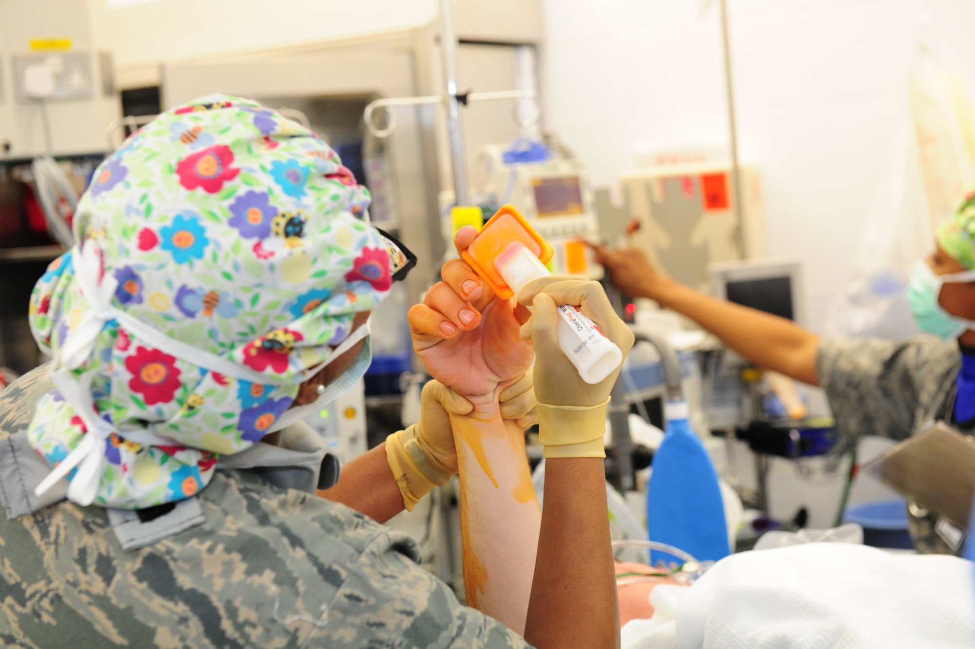 SOUTHWEST ASIA – Maj. Aretha Murray, 379th Expeditionary Medical Group nurse, preps the extremity of the patient’s hand to decrease the chances of the surgical site gaining an infection Feb. 7. Murray is deployed from Nellis AFB, Nev. (U.S. Air Force photo/Master Sgt. Brendan Kavanaugh)