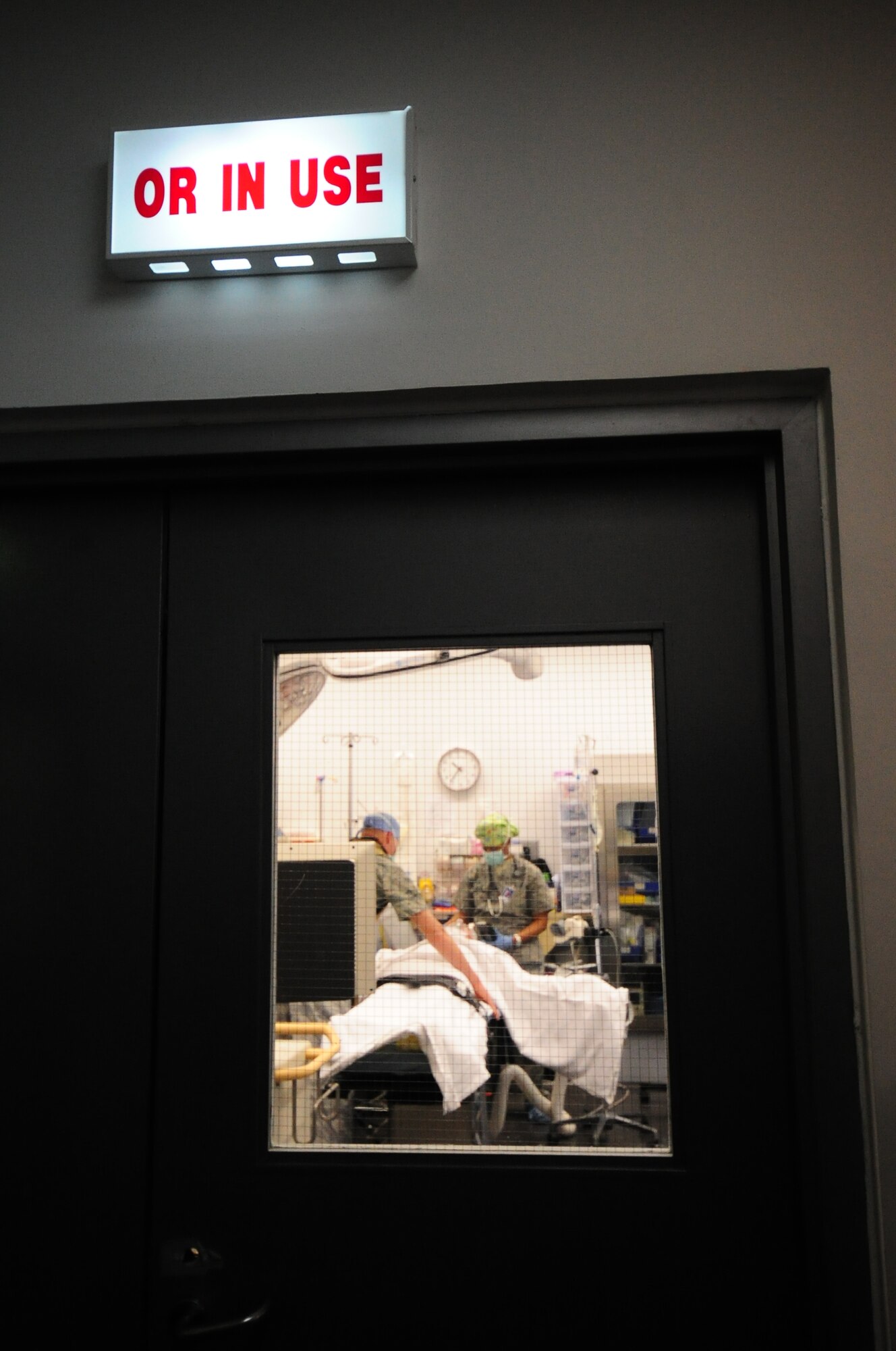 SOUTHWEST ASIA – Operating room technicians prepare a patient for surgery Feb. 7. The patient’s hand was fractured requiring the operating room team to put the patient to sleep while they perform restorative surgery on it. (U.S. Air Force photo/Master Sgt. Brendan Kavanaugh)