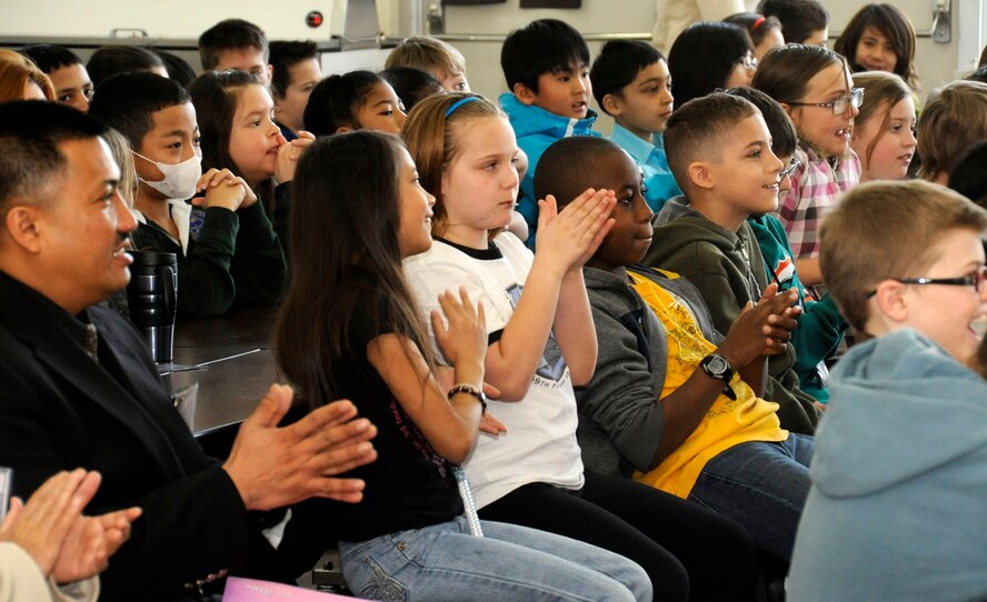 Students, family members and teachers applaud the spelling bee champion during the Cummings Elementary School Spelling Bee competition at Misawa Air Base, Japan, Feb. 4, 2013. The spelling bee competition is held annually on February. (U.S. Air Force photo by Airman 1st Class Kenna Jackson)