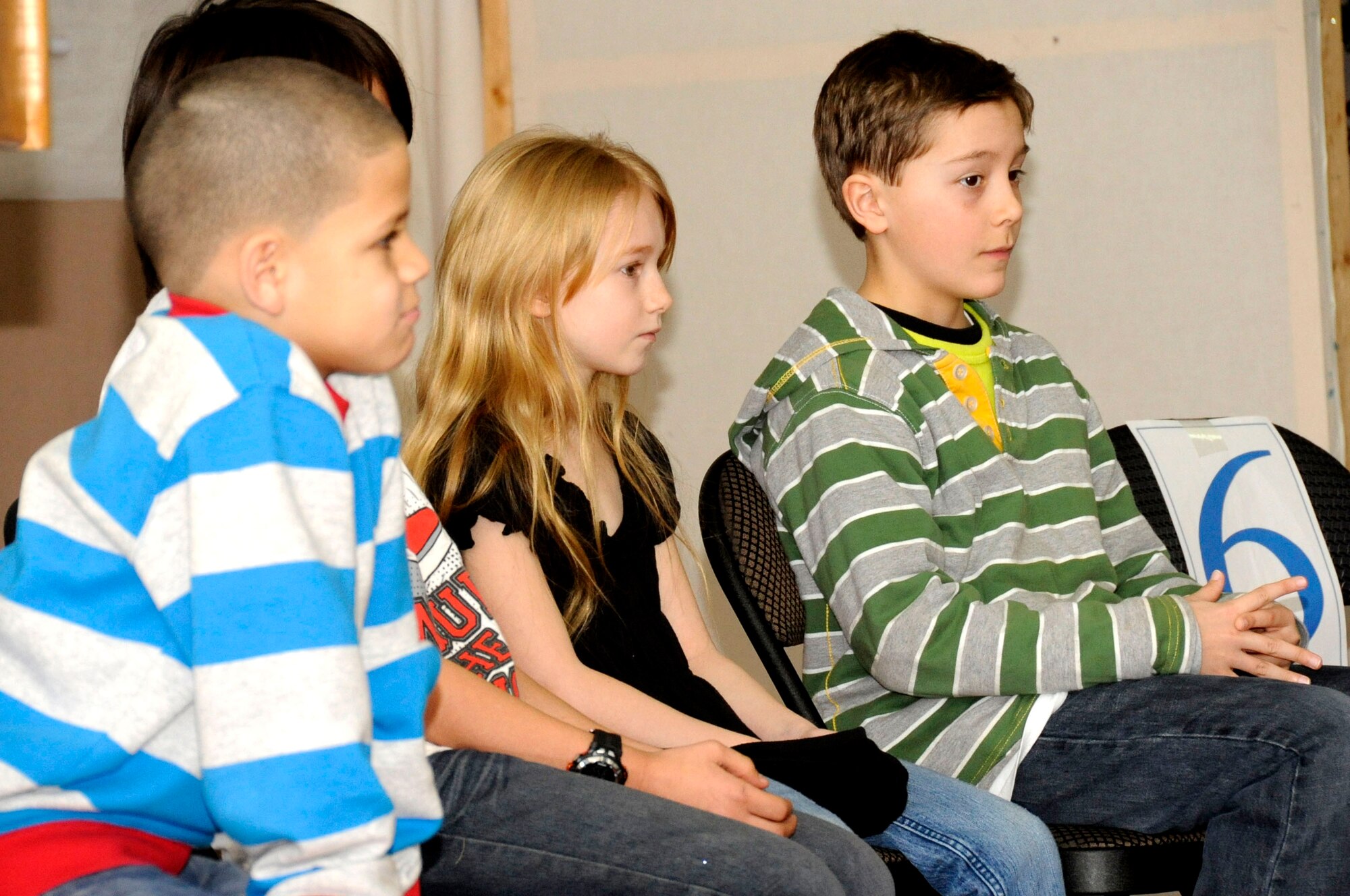 Final round spelling bee competitors wait their turn to spell during the Cummings Elementary School Spelling Bee competition at Misawa Air Base, Japan, Feb. 4, 2013. Although the competition began on Feb. 1 with 35 students, by the final round there were only 12 students left to compete. (U.S. Air Force photo by Airman 1st Class Kenna Jackson)