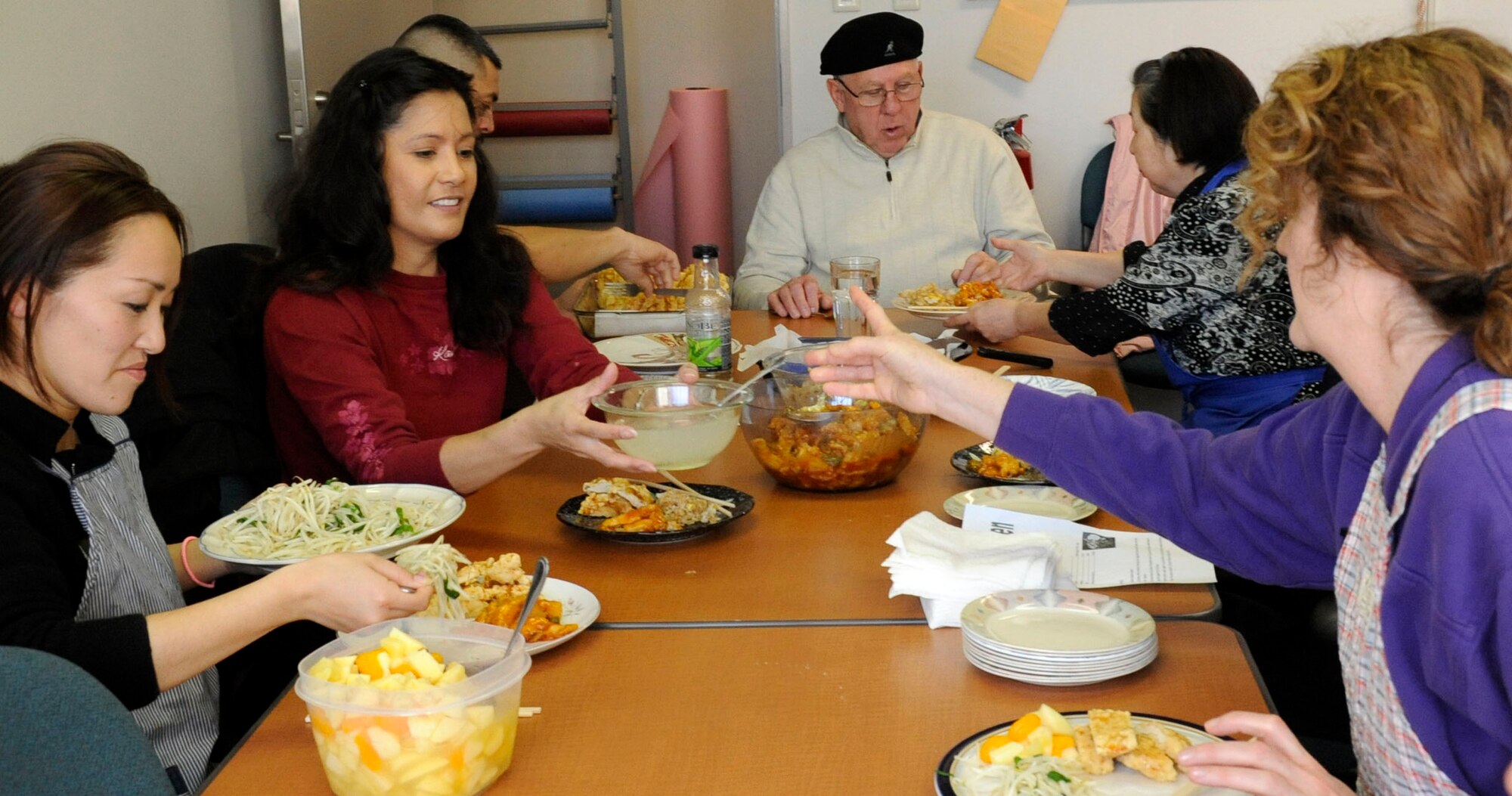 Cooking participants enjoy the meal they prepared during a cooking class in the Airman and Family Readiness Center kitchen at Misawa Air Base, Japan, Feb. 4, 2013. Besides the main dish, Chinese Lemon Chicken, the amateur chefs prepared a bowl of fruit and fried rice and brownies. The next cooking class is scheduled for Feb. 25, from 10:30 a.m. to 12:30 p.m. and Feb. 26, from 6-8 p.m. For more information about mulit-cultural events, call the Airman and Family Readiness Center at 226-4735.