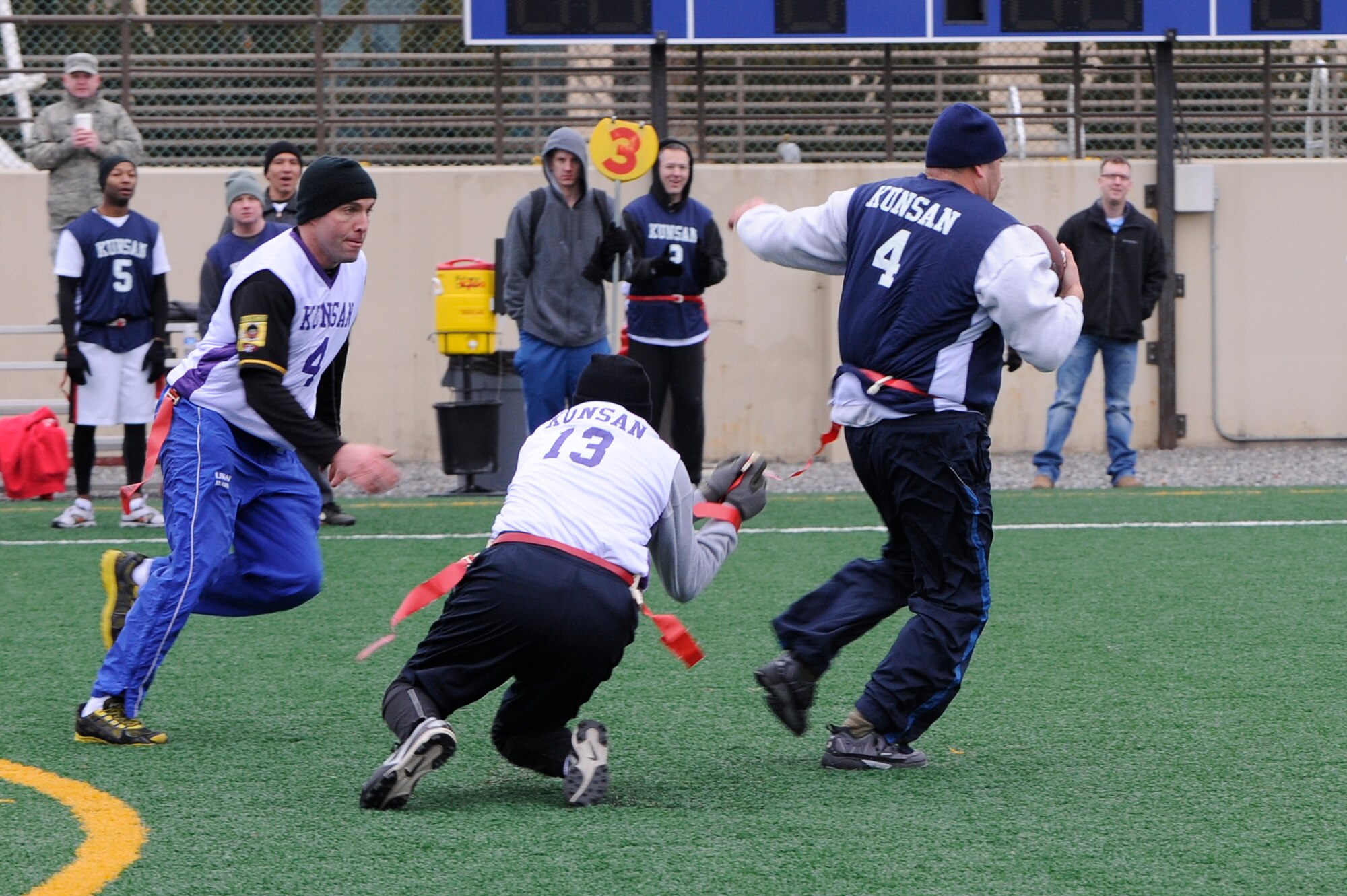 Maj. John Groff, 8th Maintenance Operations Squadron commander, takes Chief Master Sgt. Jose Tarango’s, 8th Civil Engineer Squadron, flag during the Chiefs and Eagles flag football game at Kunsan Air Base, Republic of Korea, Feb. 3, 2013. The Eagles kept pressure on the Chiefs preventing them from scoring. (U.S. Air Force photo by Senior Airman Marcus Morris/Released)