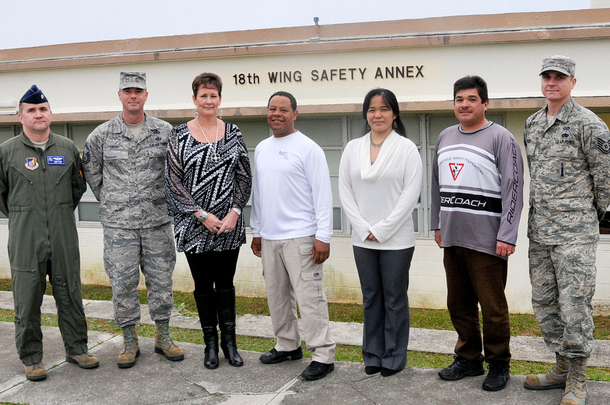 Members of the 18th Wing Ground Safety team pose for a group photo after winning the Pacific Air Forces Outstanding Achievement Award for Ground Safety Category 2 on Kadena Air Base, Japan, Feb. 7, 2013. The team provides a safety program to more than 25,000 people and protects $6 billion worth of resources. (U.S. Air Force photo/Staff Sgt. Darnell T. Cannady)