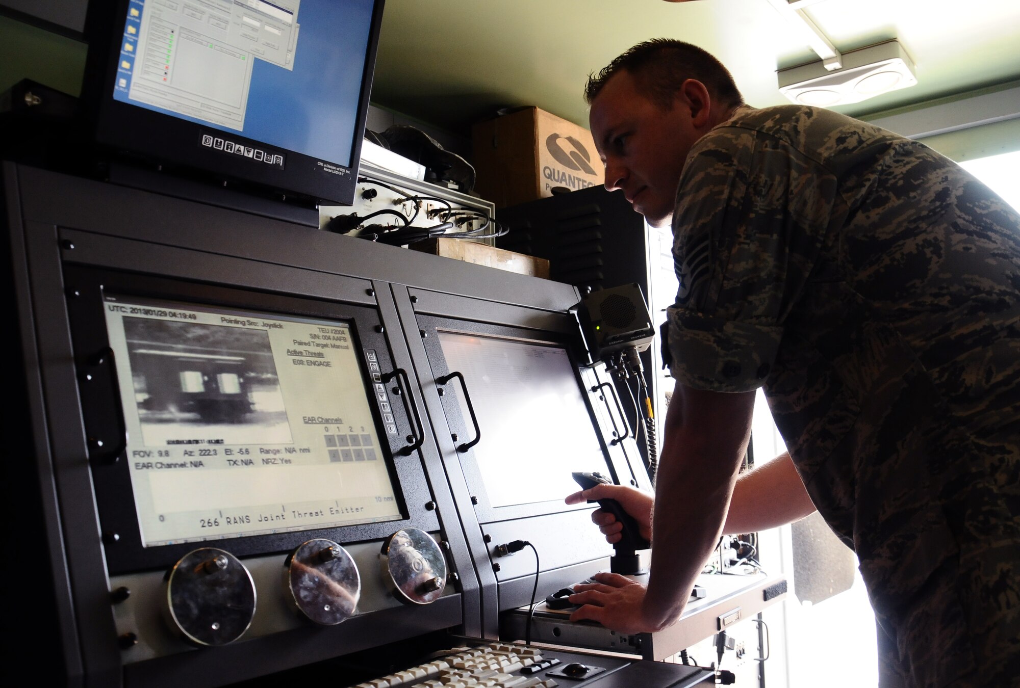 Staff Sgt. Rick Woltkamp, 266th Range Squadron ground radar systems craftsman with the Idaho Air National Guard, works with the Joint Threat Emitter at Ritidian Point on Northwest Field, Guam, Jan. 29, 2013. The Air Force and Navy radar and satellite systems, known as the JTE, provide ground threat warnings up to the aircraft to simulate an attack, improving Andersen’s operational readiness. (U.S. Air Force photo by Airman 1st Class Mariah Haddenham/Released)