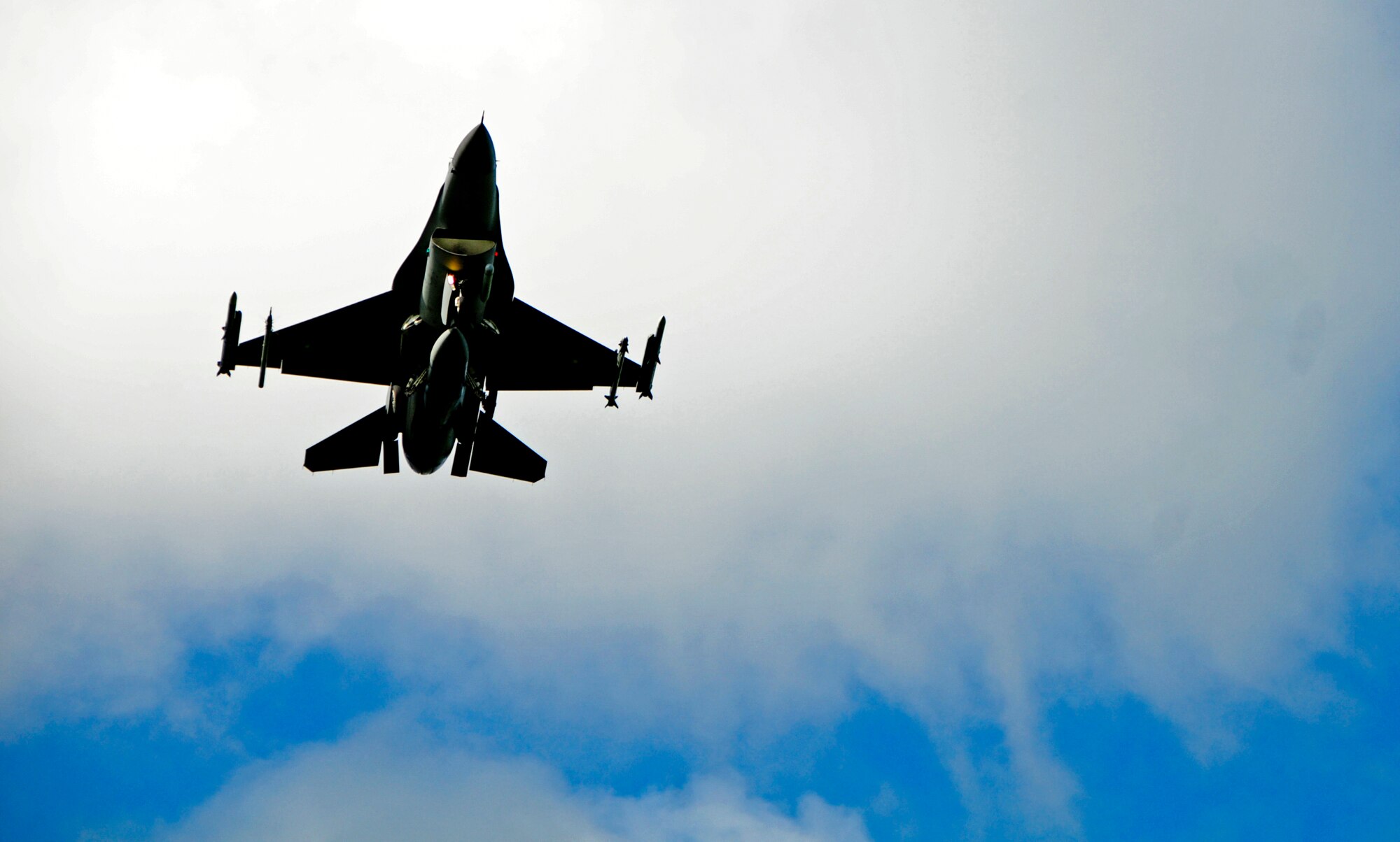 An F-16 Fighting Falcon from the 35th Fighter Wing, Misawa Air Base, Japan, flies over during aviation training relocation program at Andersen Air Force Base, Guam, Jan. 28, 2013. The ATR program is designed to increase operational readiness while reducing the impact of training on local communities. (U.S. Air Force photo by Airman 1st Class Marianique Santos/Released)