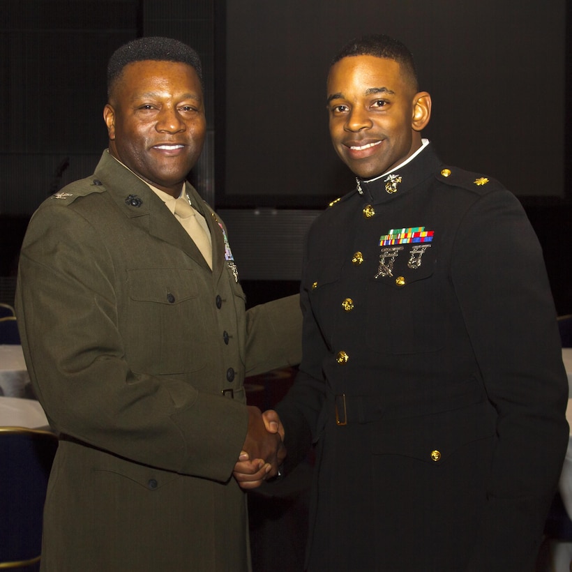 Colonel Mitchell E. Cassell, commanding officer, Marine Corps Air Station New River, N.C. and Maj. Frank Moore, diversity officer, Marine Corps Recruiting Command, pose for a picture following the Stars and Stripes Dinner at the Washington Marriott Wardman Park Hotel, Feb. 8. Cassell, a CH-53 helicopter pilot, was the recipient of the Marine Corps BEYA Service Award. 