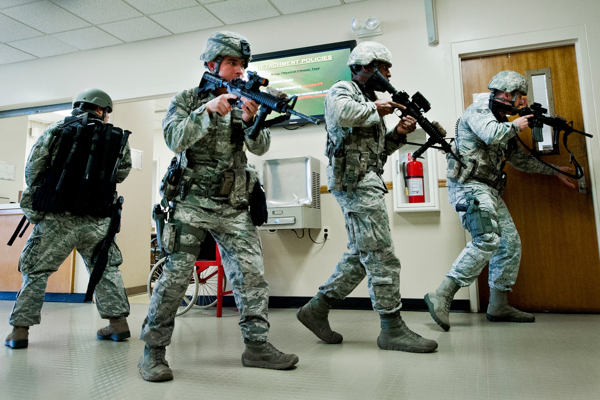 Airmen with the 96th Security Forces Squadron move through Building 845 during an active shooter exercise at Eglin Air Force Base, Feb. 6.  The Airmen entered the building to apprehend the suspect, assess the wounded and report back information to the emergency responders.  (U.S. Air Force photo/Samuel King Jr.)