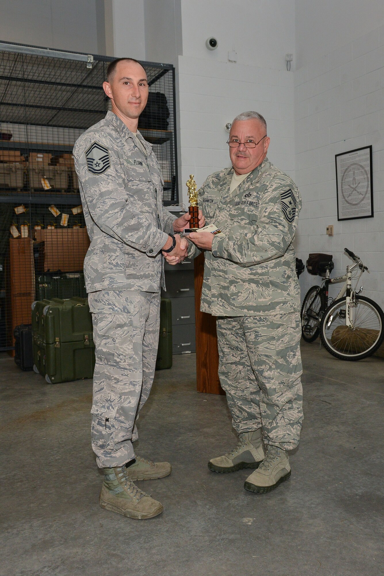 National Guard Senior Master Sgt.Daniel Florin accepts the trophy for Senior NCO of The Quarter, February 9, 2013 at Savannah Air National Guard Base in Garden City, Ga. Florin is part of the 165th Airlift Wing Security Forces Squadron. (National Guard photo by Tech. Sgt. Charles Delano/released)