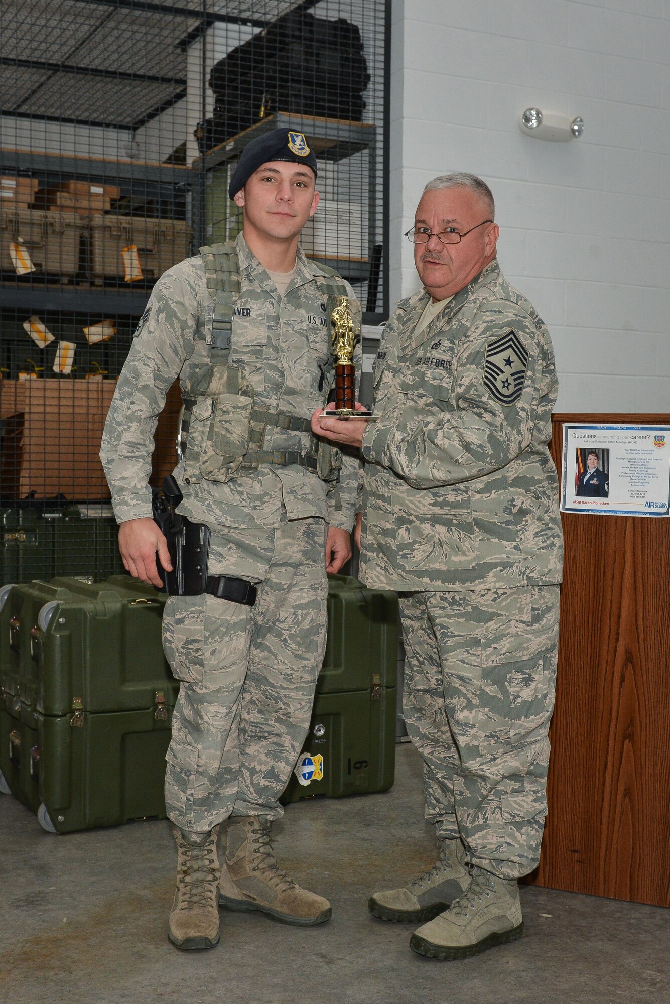 National Guard Senior Airman Jeffrey Weaver accepts the trophy for Airman of The Quarter, February 9, 2013 at Savannah Air National Guard Base in Garden City, Ga. Weaver is part of the 165th Airlift Wing Security Forces Squadron. (National Guard photo by Tech. Sgt. Charles Delano/released)