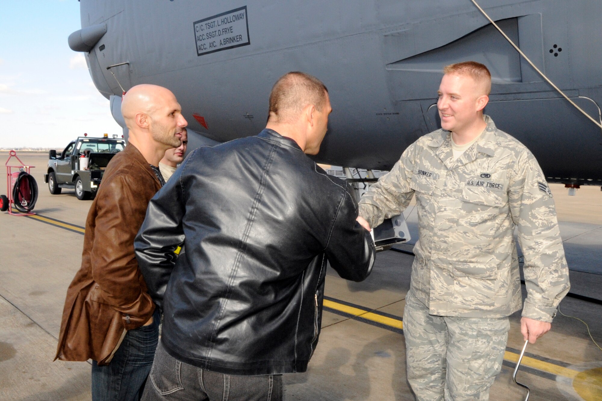 Christopher Daniels and Frankie Kazarian, who are Total Nonstop Action wrestlers, meet with Senior Airman Aaron Brinker, crew chief, 2nd Aircraft Maintenance Squadron, during a tour of a B-52 Stratofortess at Barksdale Air Force Base, La., Feb. 8, 2013. The two wrestlers visited Barksdale for a meet and greet session with the troops at the Barksdale Exchange. They competed during the Road to Lock Down event at the Centurylink Center in Bossier City, La., Feb. 8. (U.S. Air Force photo by Master Sgt. Jeff Walston)