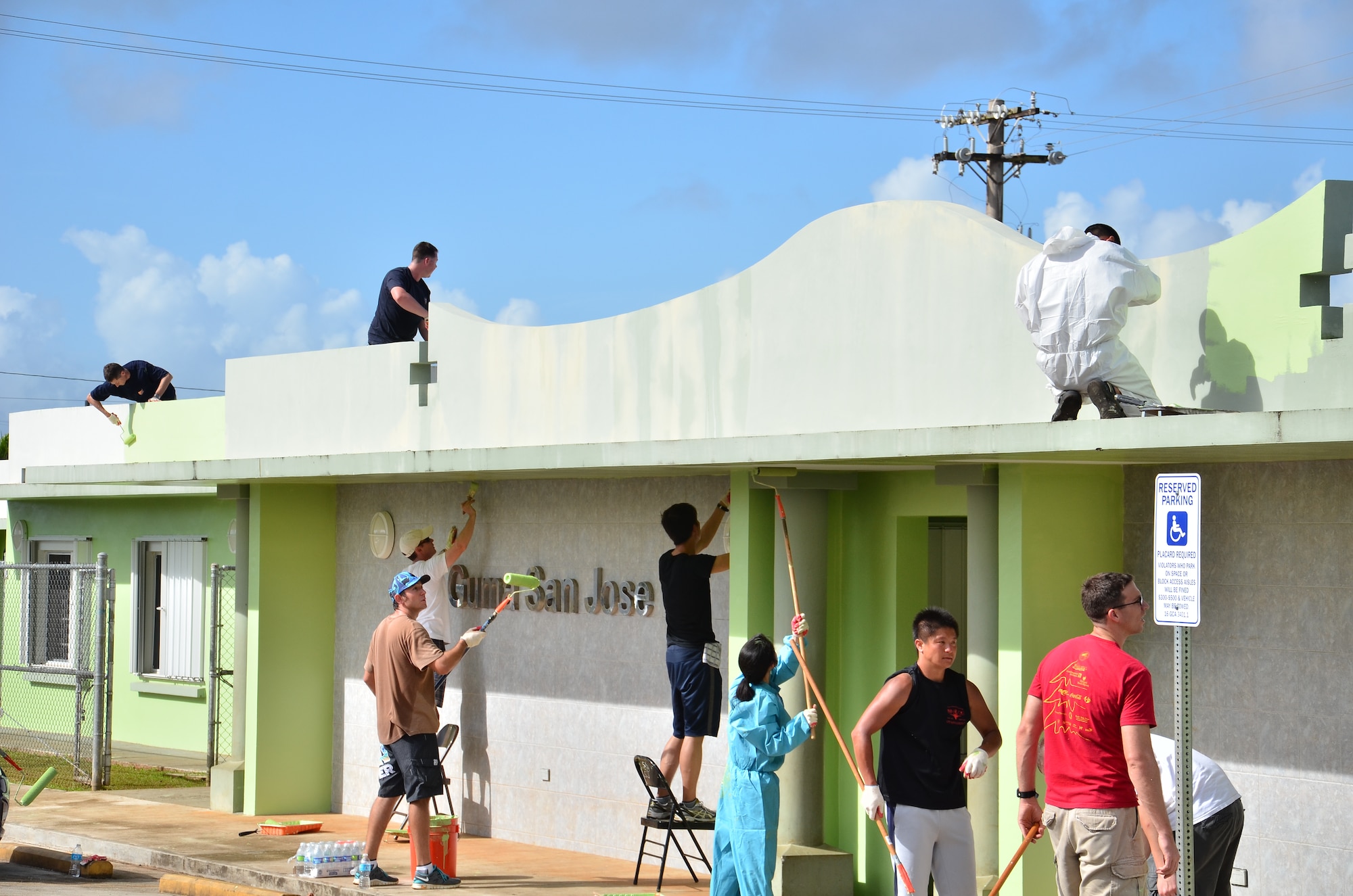 Personnel from the U.S. Air Force, Japan Air Self-Defense Force and Royal
Australian Air Force repaint the exterior walls and ceilings at the Guma' San Jose Homeless Shelter in Dededo, Guam on Feb. 9, 2013. More than 170 personnel from the three nations, all on Guam as participants in Cope North 13, volunteered at four local sites in Dededo, thanking the community for their support during the two-week exercise. (U.S. Air Force photo by Staff Sgt. Alexandre Montes/RELEASED) 
