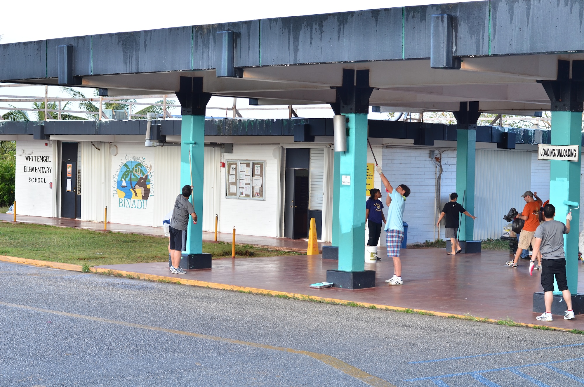 Personnel from the U.S. Air Force, Japan Air Self-Defense Force and Royal
Australian Air Force repaint columns at the Wettengel Elementary School in Dededo, Guam on Feb. 9, 2013. More than 170 personnel from the three nations, all on Guam as participants in Cope North 13, volunteered at four local sites in Dededo, thanking the community for their support during the two-week exercise. (U.S. Air Force photo by Staff Sgt. Alexandre Montes) 
