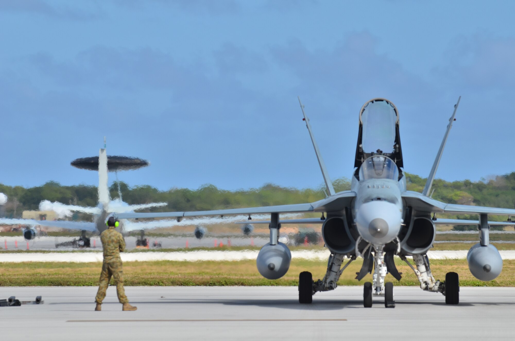 Royal Australian Air Force Airmen start up their F/A-18 Hornet on the Andersen Air Force Base, Guam flight line during Cope North 2013 Feb 8. 2013. Cope North is an annual air combat tactics, humanitarian assistance and disaster relief exercise designed to increase the readiness and interoperability of the U.S. Air Force, Japan Air Self-Defense Force and Royal Australian Air Force. (U.S. Air Force photo by Staff Sgt. Alex Montes/RELEASED)