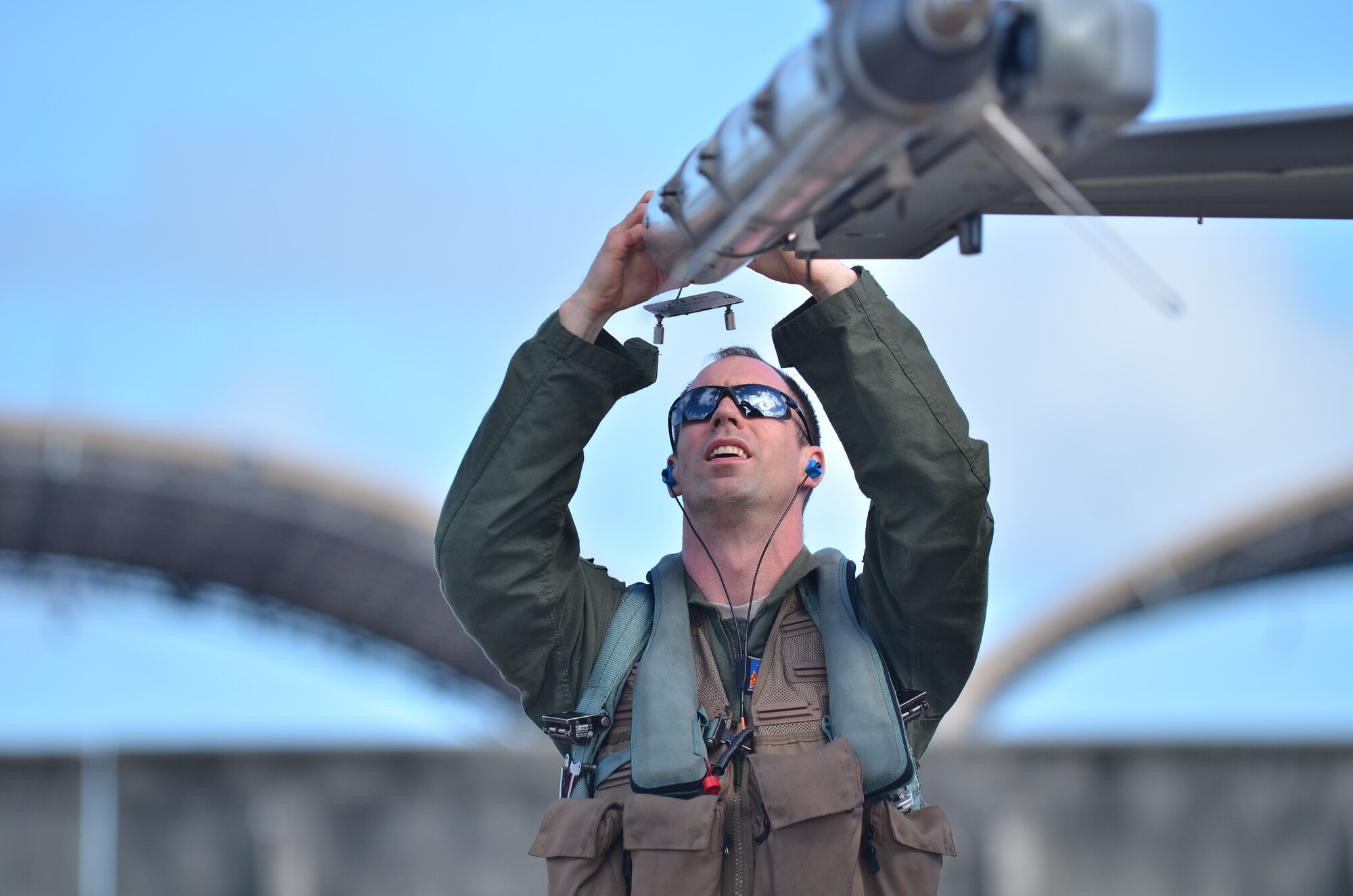 U.S. Air Force Major Peter Kasarkis 354th Fighter Wing, Eielson Air Force Base, Alaska, performs pre flight checks on a U.S. Air Force F-16 during Cope North 2013 at Andersen Air Force Base, Guam Feb 8. 2013. Cope North is an annual air combat tactics, humanitarian assistance and disaster relief exercise designed to increase the readiness and interoperability of the U.S. Air Force, Japan Air Self-Defense Force and Royal Australian Air Force. (U.S. Air Force photo by Staff Sgt. Alex Montes/RELEASED)