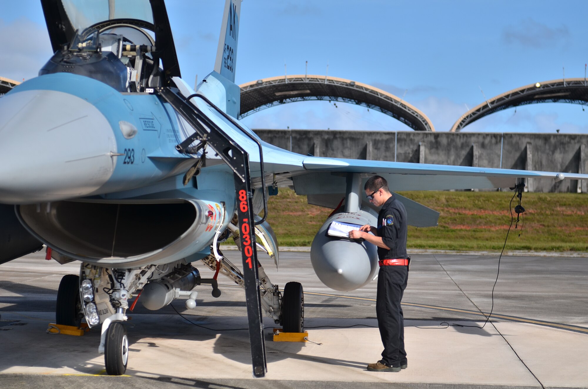 U.S. Air Force Airman David Saldivar, 18th Expeditionary Aircraft Maintenance Squadron, Kadena Air Base, Japan, reads through his pre flight checklist to ensure proper function of a U.S. Air Force F-16 during Cope North 2013 at Andersen Air Force Base, Guam Feb 8. 2013. Cope North is an annual air combat tactics, humanitarian assistance and disaster relief exercise designed to increase the readiness and interoperability of the U.S. Air Force, Japan Air Self-Defense Force and Royal Australian Air Force. (U.S. Air Force photo by Staff Sgt. Alex Montes/RELEASED)