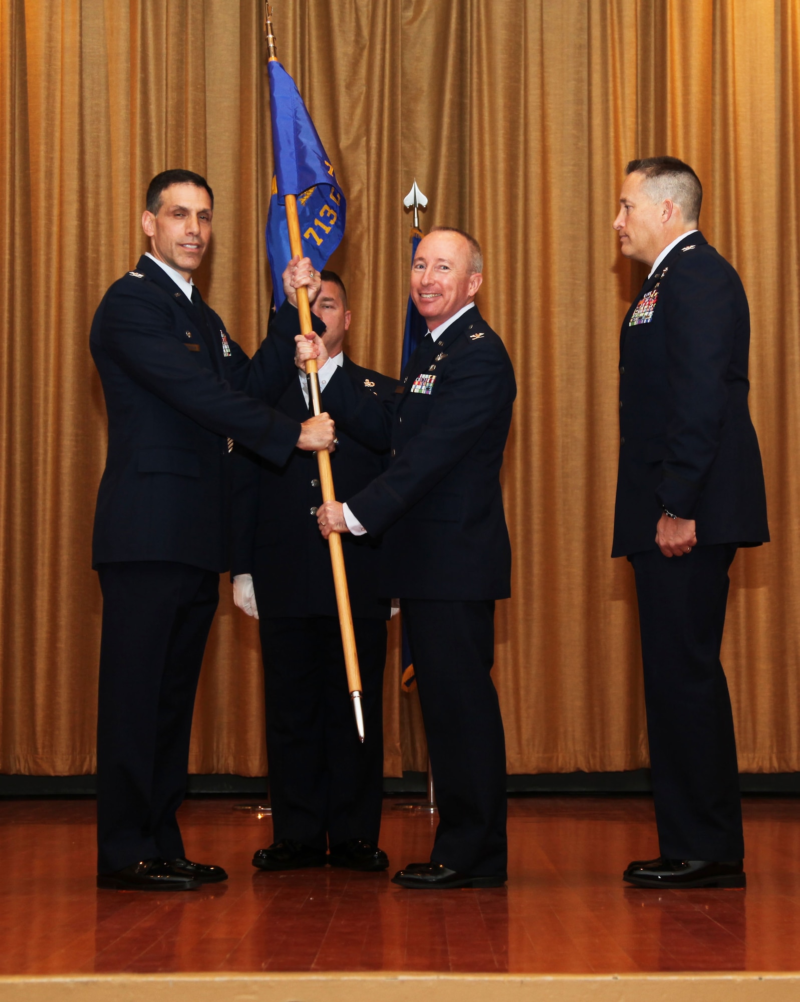 Colonel Mark Metz relinquishes command of the 713th COS during a ceremony held here Feb. 9. 
