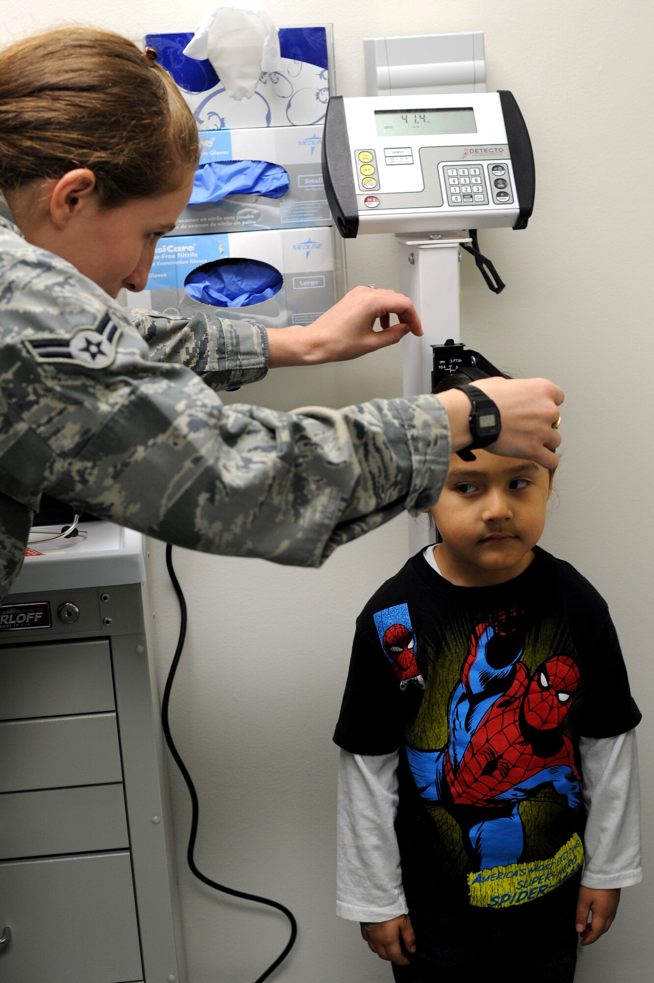 YOKOTA AIR BASE, Japan-- Cante Red Horse, son of Staff Sgt. Roddy Red Horse, 374th Communication Squadron, gets his height measured by Airman 1st Class Jacquelyn Longar, an aerospace medical technician at the 374th Medical Operation Squadron Pediatrics Clinic, Jan. 23, 2013, at Yokota Air Base, Japan.  The clinic was recently renovated to include energy-efficient light installation, facility upgrades 