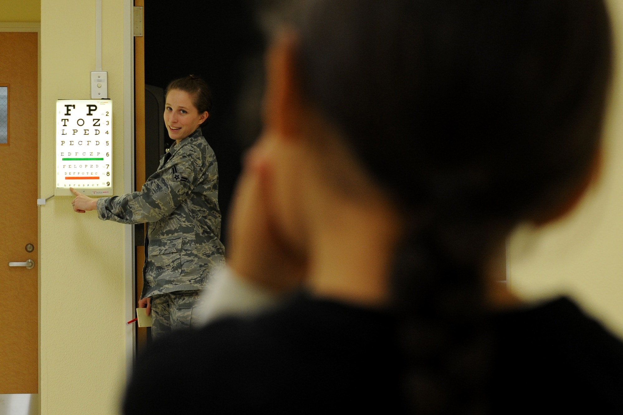 YOKOTA AIR BASE, Japan -- Airman 1st Class Jacquelyn Longar, an aerospace medical technician at the 374th Medical Operation Squadron Pediatrics Clinic, conducts a vision test Jan. 23, 2013, at Yokota Air Base, Japan. The pediatrics clinic renovated its facilities recently, adding new treatment and briefing rooms. (U.S. Air Force photo by Airman 1st Class Meagan Schutter)