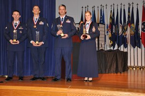 The wingwide award winners for 2012, SrA Moss, TSgt Holtgrefe, SMSgt Lange, and First Shirt MSgt Rooney.The 940th Wing held their first awards banquet Feb 9th during the UTA weekend.  (U.S. Air Force photo/SrA Adam Hamar)