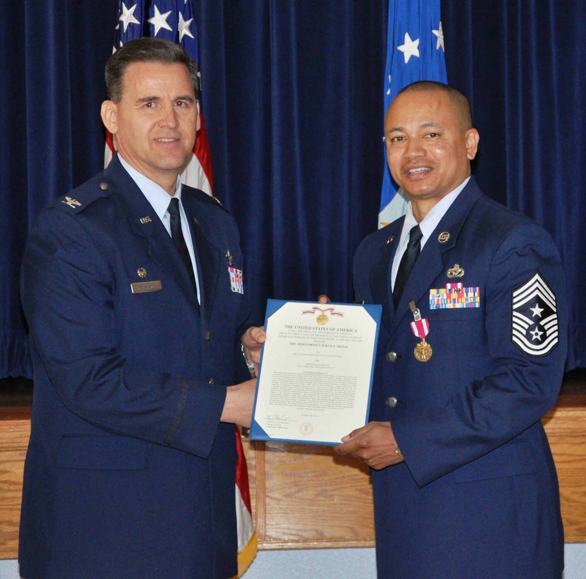 CMSgt Henderson recieves the Meritorious Service Medal from Col Cavanagh, 940th Wing Commander, during his retirement ceremony on Feb 10, during the UTA weekend.  Chief Henderson retires from the US Air Force after 24 years of service, four of which were as the command chief of the 940th Wing. (U.S. Air Force photo/SrA Adam Hamar)