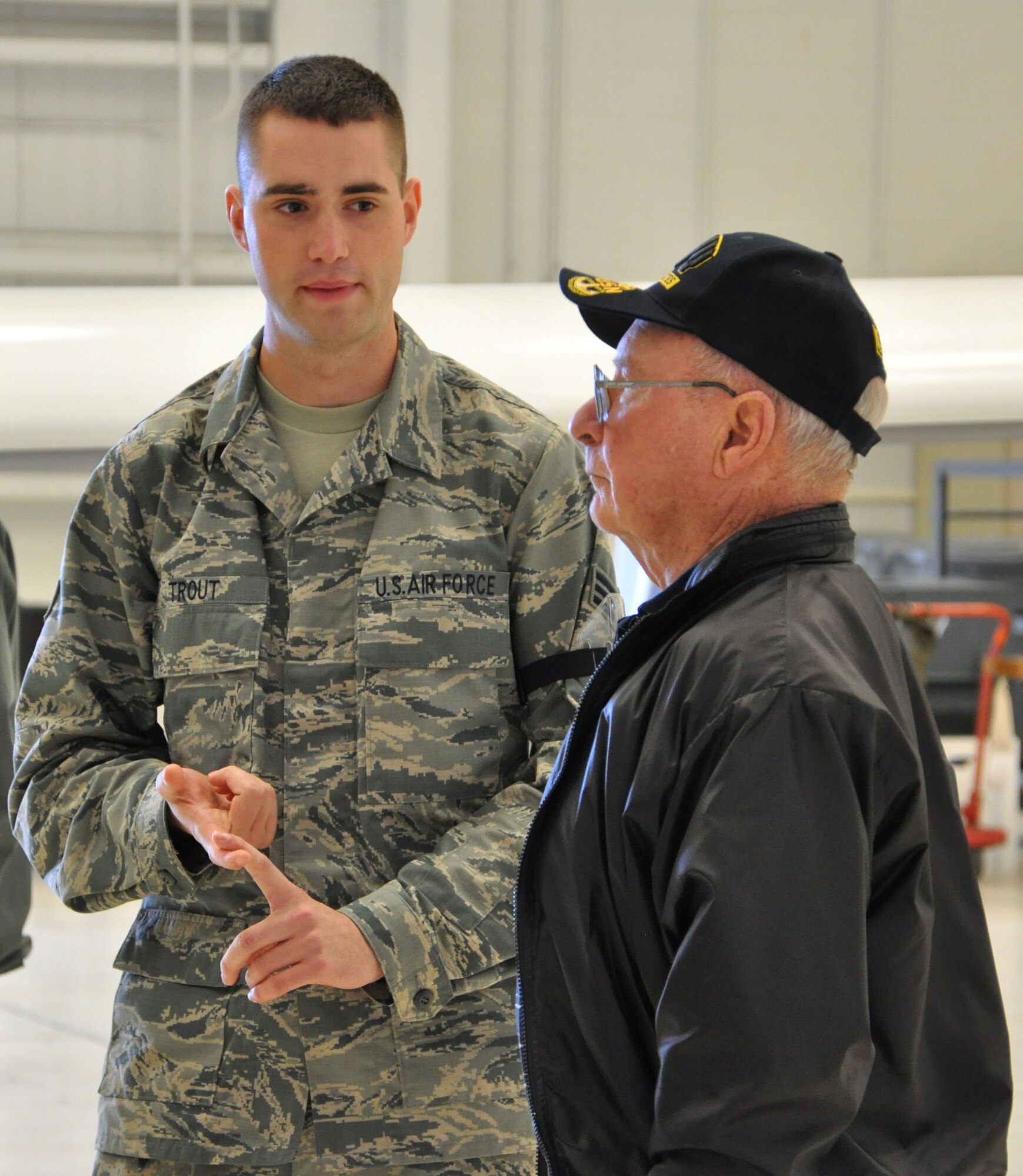 Senior Airman Jonathn Trout, 13 Reconnaissance Squadron maintaner, explains some of the capabilities of the RQ-4 Global Hawk to one of the retired teachers on tour.  The 940th Wing hosted the Ca Retired Teachers Association during the UTA weekend.  (U.S. Air Force photo/SrA Adam Hamar)