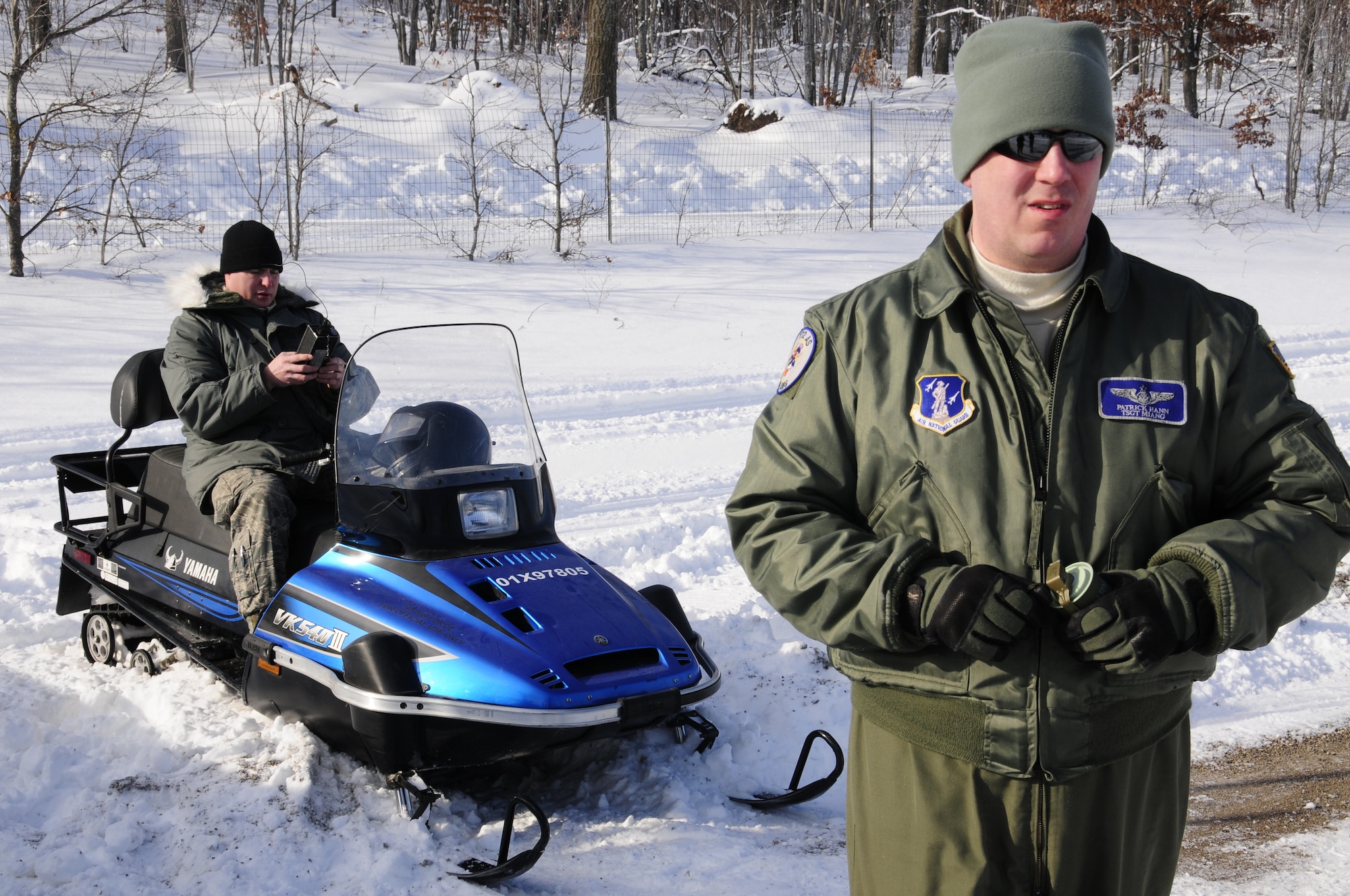 U.S. Air Force Tech. Sgt. Patrick Hann 172nd Airlift Squadron (front)Airman 1st Class Nickolas Holbrook, 110th Airlift Wing, Communications Flight, Grayling Air Gunnery Range, Frederic, Mich., Jan. 26, 2013. Holbrook launched rockets to provide response training for the pilots. (U.S. Air Force photo by Airman Justin Andras/released)
