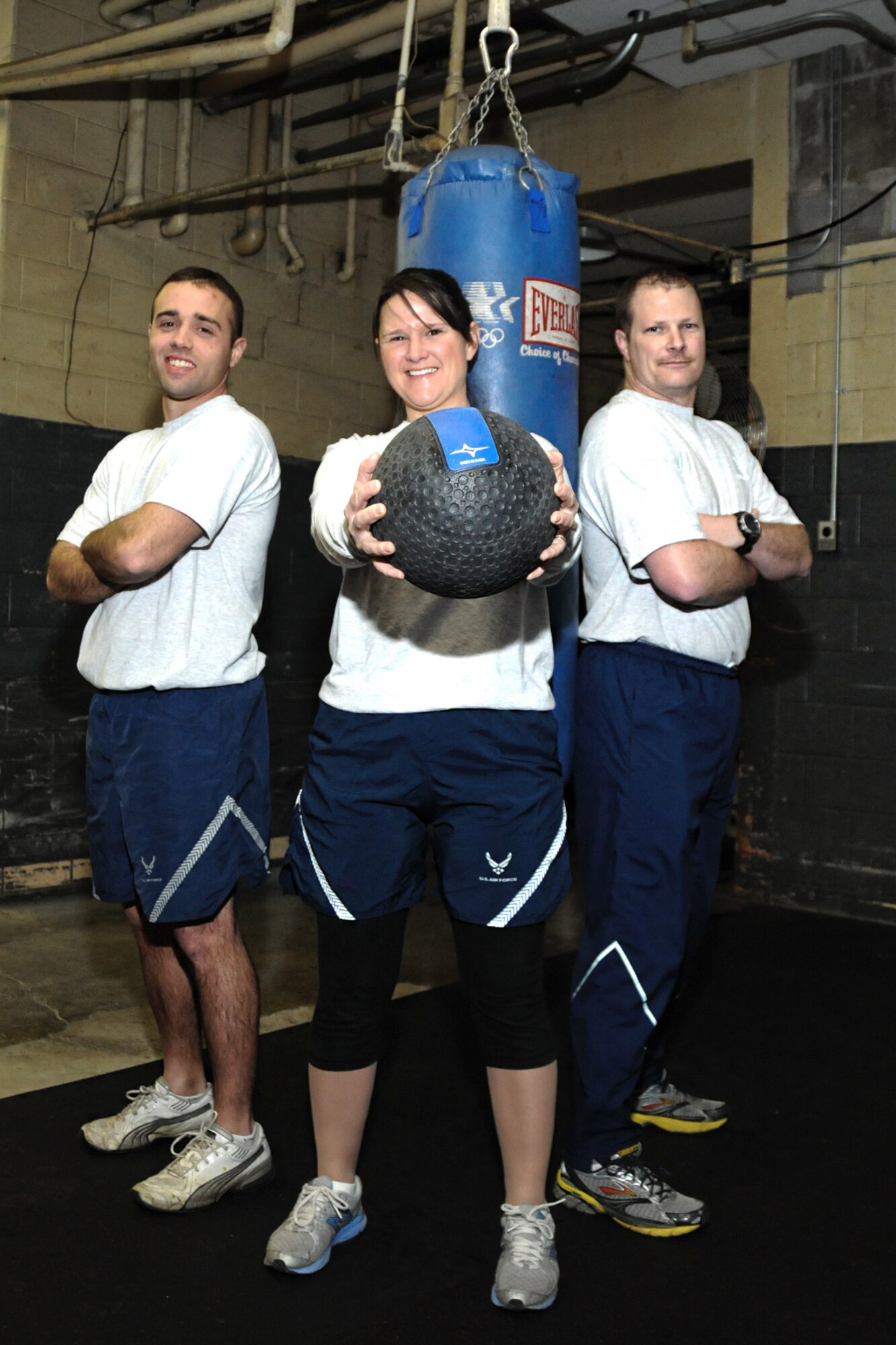 Staff Sgt. James Mack, Technical Sgt. Janice Stockett, and Staff Sgt. Eric McCulley, all members of the 127th Security Forces Squadron at Selfridge Air National Guard Base, Mich., recently earned Physical Training Leader Certification. They are seen in the 127th Wing’s fitness center, Feb. 10, 2013. The certification identifies them by the Air Force as qualified fitness training leaders for the 127th Wing.  (Air National Guard Photo by TSgt. Robert Hanet)