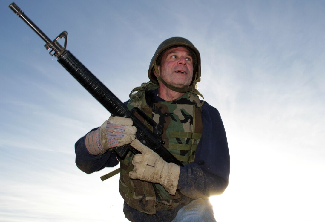 East View High School teacher Joel Kiekbusch checks with his squad before heading toward the next obstacle on the bayonet assault course Jan. 29. Kiekbusch was one of 40 educators from Recruiting Station Twin Cities who traveled to California for an educators workshop. For additional imagery from the event, visit www.facebook.com/rstwincities. 