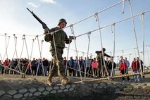 Marines demonstrate how to complete one of the many bayonet assault course obstacles for teachers from Recruiting Stations Twin Cities and Kansas City who attended an educators workshop Jan. 29. For additional imagery from the event, visit www.facebook.com/rstwincities. 