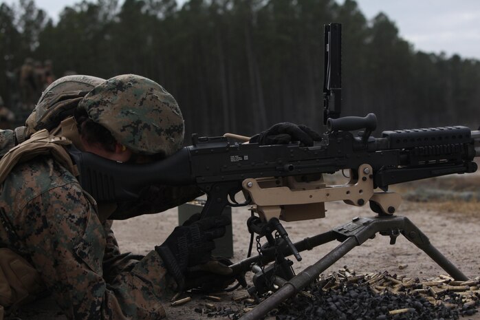 Marines with Bridge Company, 8th Engineer Support Battalion, 2nd Marine Logistics Group reload an M-240 machine gun during a training exercise at a machine gun range aboard Camp Lejeune, N.C., Jan. 30, 2013. Marines practiced correct operations of the weapons, to include loading, firing and taking actions to fix malfunctions.