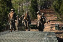 A 7.62 mm round is readied to fire from an M-240 machine gun by a Marine with Bridge Company, 8th Engineer Support Battalion, 2nd Marine Logistics Group during a training exercise aboard Camp Lejeune, N.C., Jan. 30, 2013. The M-240 is capable of firing 750 rounds per minute and requires at least two operators to be used effectively.