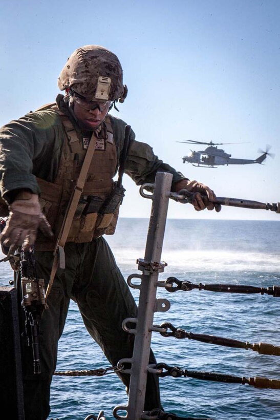 U.S. Marine Cpl. Adrian Edeyaoch with Maritime Raid Force, 15th Marine Expeditionary Unit, practices visit, board, search and seizure procedures during Exercise Leading Edge 13 aboard USS Winston S. Churchill (DDG 81), Feb. 5. The exercise is a multinational and interagency supported exercise designed to develop and refine weapons integration capabilities among partnering nations including suspect maritime material inspections, seizure and disposition.  The 15th MEU is deployed as part of the Peleliu Amphibious Ready Group as a U.S. Central Command theatre reserve force, providing support for maritime security operations and theatre security cooperation efforts in the U.S. 5th Fleet area of responsibility. (U.S. Marine Corps photo by Cpl. Bobby J. Gonzalez/Released)