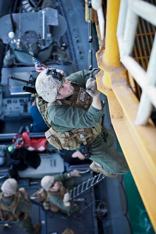 U.S. Marine Corps Pfc. Darell Lippert, Maritime Raid Force, 15th Marine Expeditionary Unit, climbs a ladder during gas and oil platform seizure training during Exercise Leading Edge 13, Feb. 6. The exercise is a multinational and interagency supported exercise designed to develop and refine weapons integration capabilities among partnering nations including suspect maritime material inspections, seizure and disposition.  The 15th MEU is deployed as part of the Peleliu Amphibious Ready Group as a U.S. Central Command theatre reserve force, providing support for maritime security operations and theatre security cooperation efforts in the U.S. 5th fleet are of responsibility. (U.S. Marine Corps photo by Cpl. Bobby J. Gonzalez/Released)