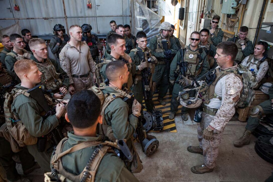 U.S. Marines with Maritime Raid Force, 15th Marine Expeditionary Unit, listen to a brief after completing gas and oil platform seizure training during Exercise Leading Edge 13, Feb. 7. The exercise is a multinational and interagency supported exercise designed to develop and refine weapons integration capabilities among partnering nations including suspect maritime material inspections, seizure and disposition. The 15th MEU is deployed as part of the Peleliu Amphibious Ready Group as a U.S. Central Command theatre reserve force, providing support for maritime security operations and theatre security cooperation efforts in the U.S. 5th Fleet area of responsibility. (U.S. Marine Corps photo by Cpl. Bobby J. Gonzalez/Released)