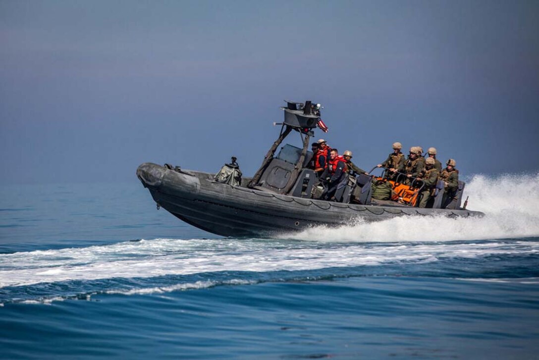 U.S. Marines with Maritime Raid Force, 15th Marine Expeditionary Unit, ride in a rigid hull inflatable boat after completing gas and oil platform seizure training during Exercise Leading Edge 13, Feb. 7. The exercise is a multinational and interagency supported exercise designed to develop and refine weapons integration capabilities among partnering nations including suspect maritime material inspections, seizure and disposition. The 15th MEU is deployed as part of the Peleliu Amphibious Ready Group as a U.S. Central Command theatre reserve force, providing support for maritime security operations and theatre security cooperation efforts in the U.S. 5th Fleet area of responsibility. (U.S. Marine Corps photo by Cpl. Bobby J. Gonzalez/Released)