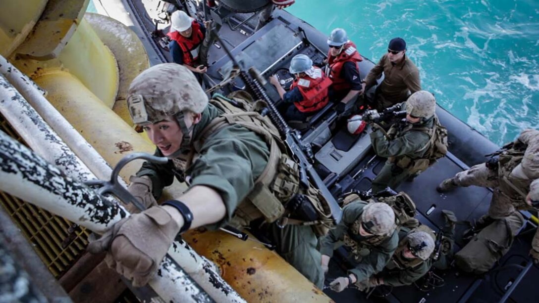 U.S. Marine Corps Pfc. Tyler Coleman, Maritime Raid Force, 15th Marine Expeditionary Unit, climbs a ladder during gas and oil platform seizure training during Exercise Leading Edge 13, Feb. 7. The exercise is a multinational and interagency supported exercise designed to develop and refine weapons integration capabilities among partnering nations including suspect maritime material inspections, seizure and disposition. The 15th MEU is deployed as part of the Peleliu Amphibious Ready Group as a U.S. Central Command theatre reserve force, providing support for maritime security operations and theatre security cooperation efforts in the U.S. 5th Fleet area of responsibility. (U.S. Marine Corps photo by Cpl. Bobby J. Gonzalez/Released)
