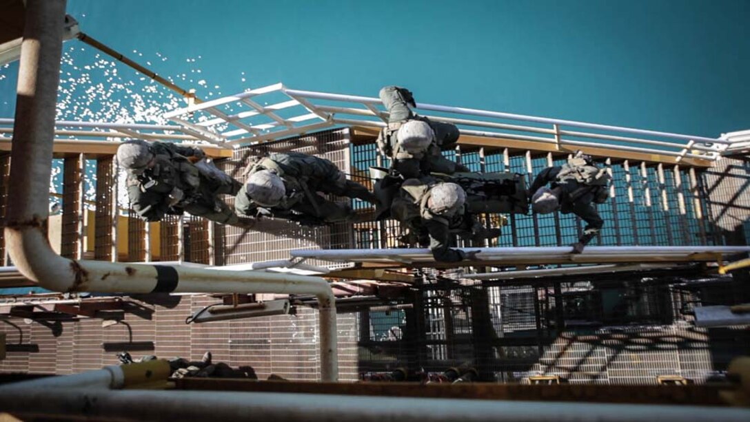 U.S. Marines with Maritime Raid Force, 15th Marine Expeditionary Unit, carry a mock casualty during gas and oil platform seizure training during Exercise Leading Edge 13, Feb. 7. The exercise is a multinational and interagency supported exercise designed to develop and refine weapons integration capabilities among partnering nations including suspect maritime material inspections, seizure and disposition.  The 15th MEU is deployed as part of the Peleliu Amphibious Ready Group as a U.S. Central Command theatre reserve force, providing support for maritime security operations and theatre security cooperation efforts in the U.S. 5th Fleet area of responsibility. (U.S. Marine Corps photo by Cpl. Bobby J. Gonzalez/Released)